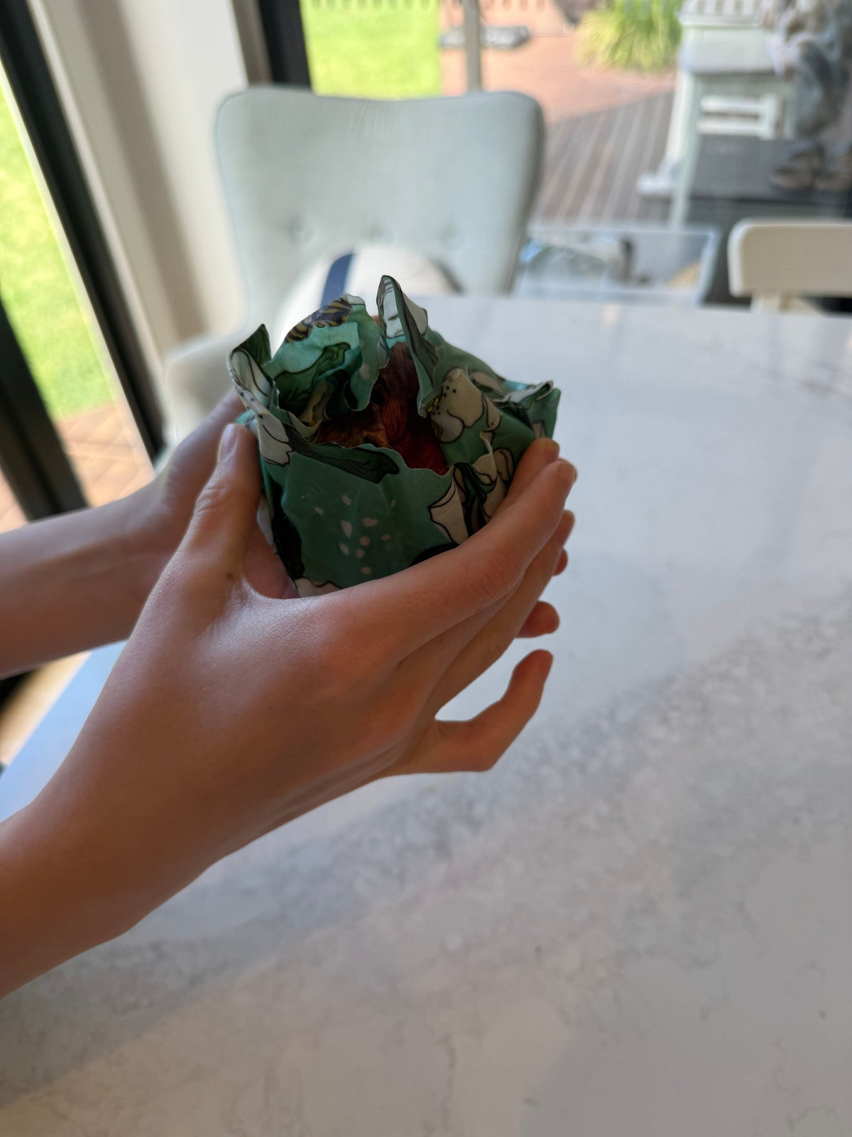 Half onion wrapped and sealed in a beeswax wrap