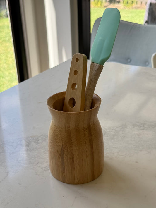 Utensil holder with our bamboo herb stripper; spatula for styling only