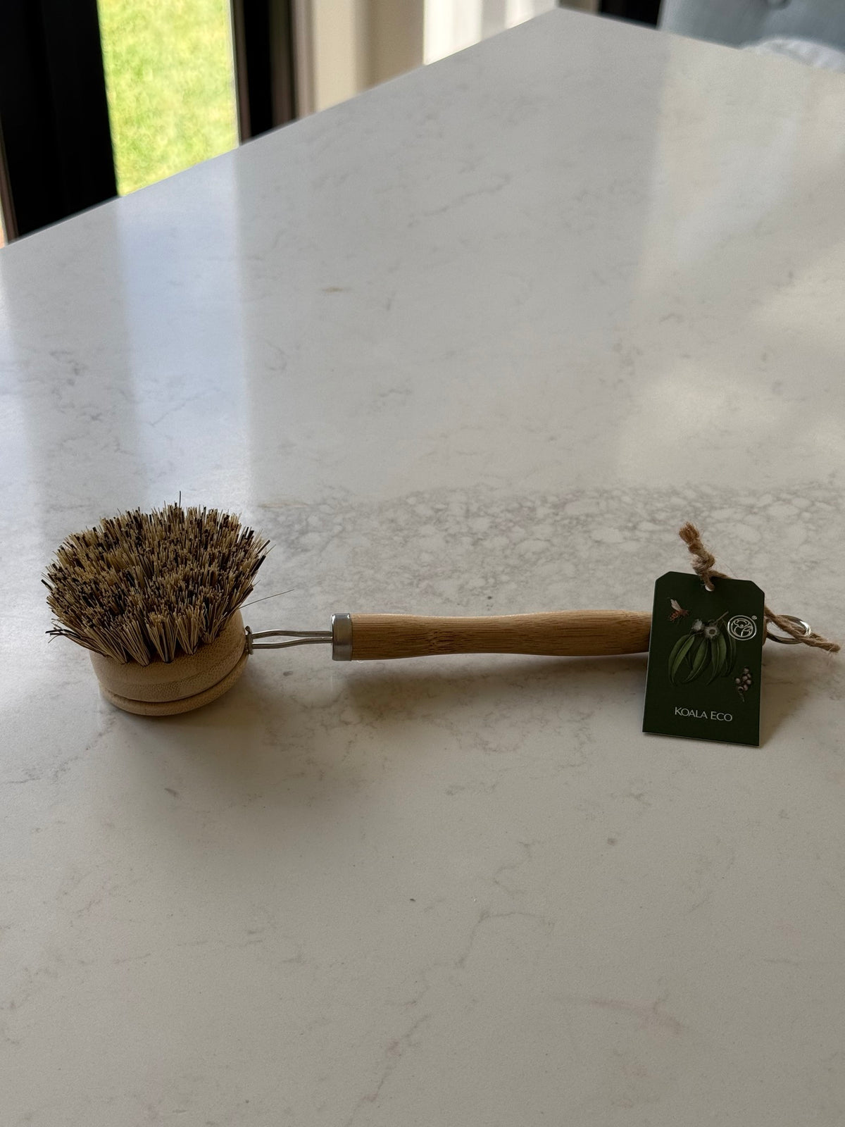 Koala Eco bamboo dish brush with plant bristles, on our kitchen bench in Bayside