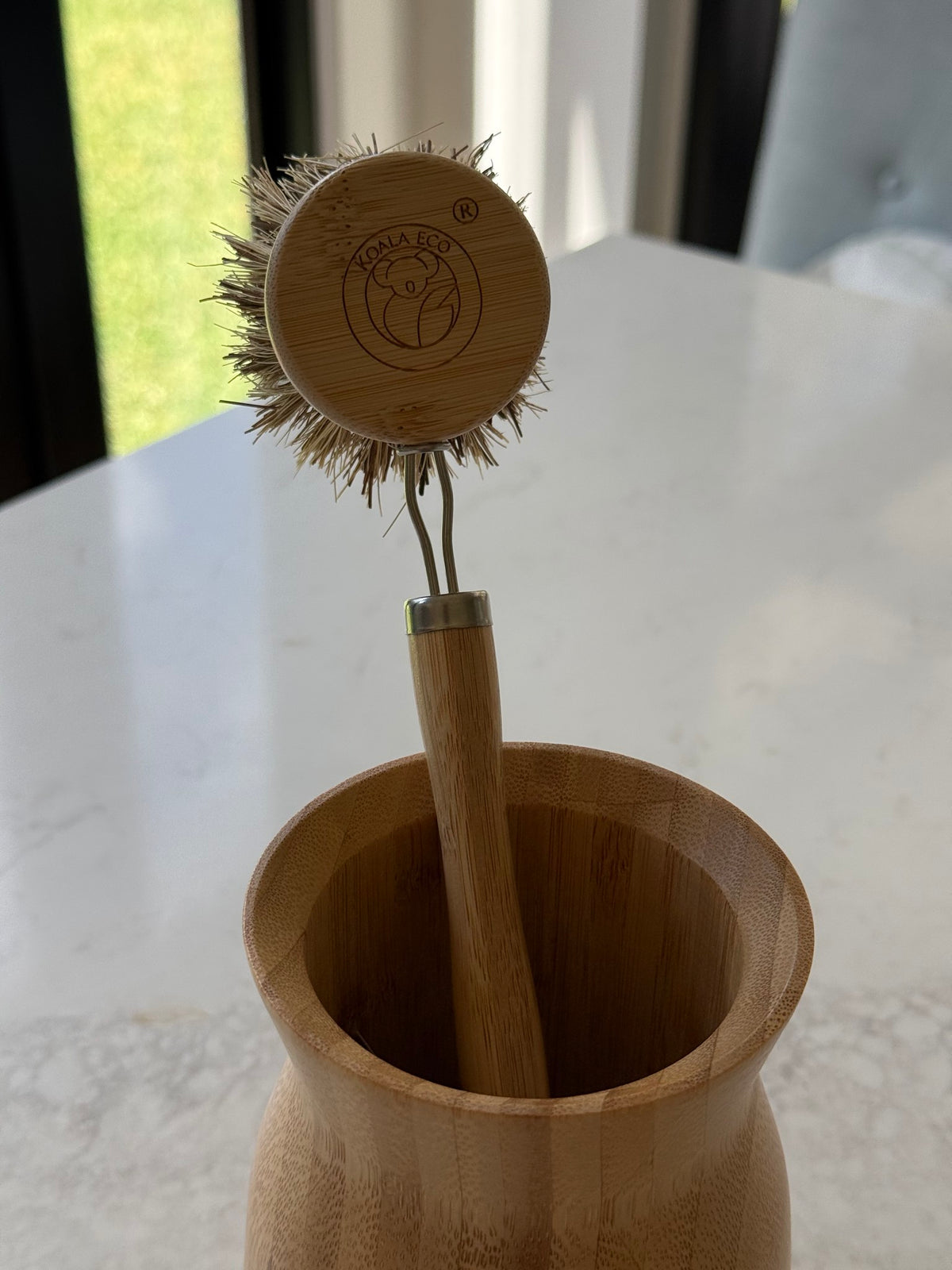 Dish brush standing in our bamboo utensil holder