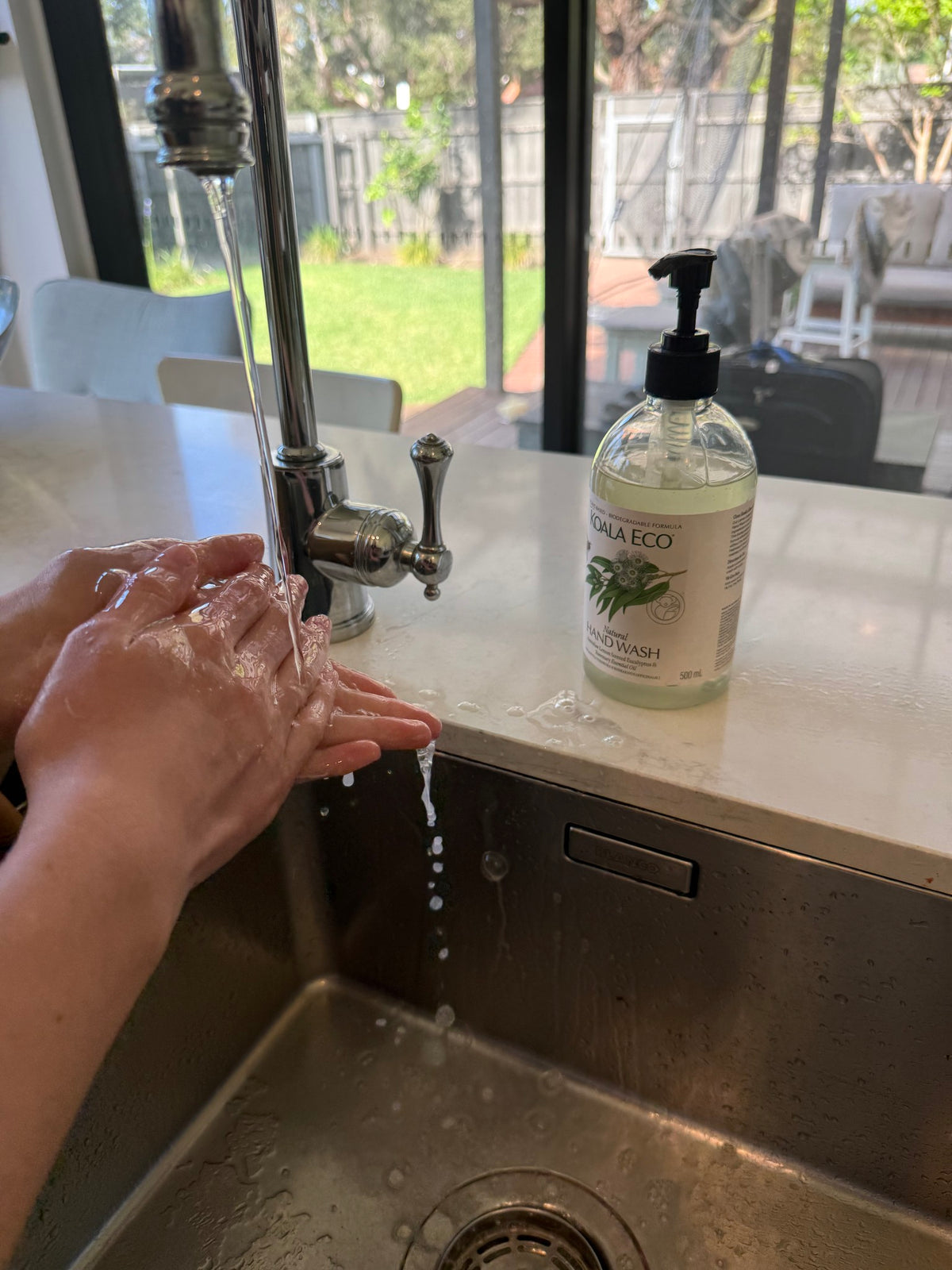 Washing hands at our kitchen sink with Koala Eco hand wash