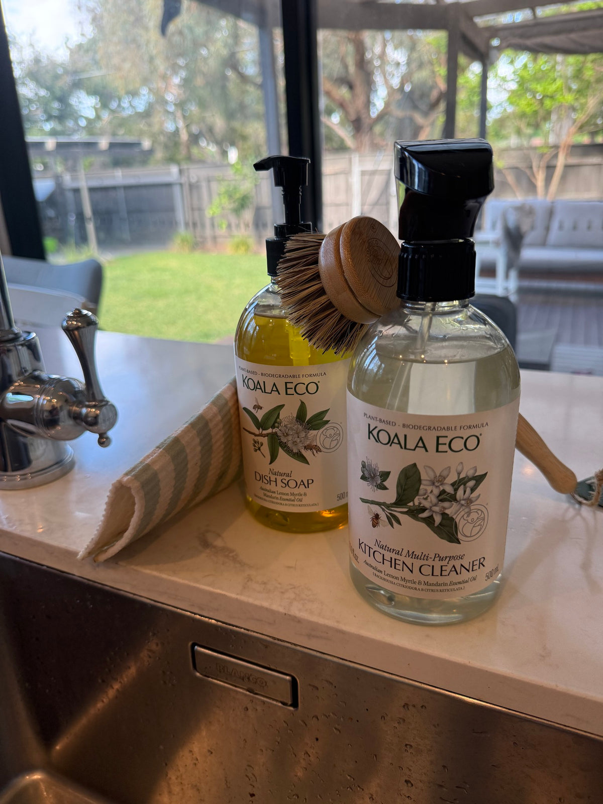 Koala Eco dish soap, kitchen cleaner and dish brush by our kitchen sink in Bayside