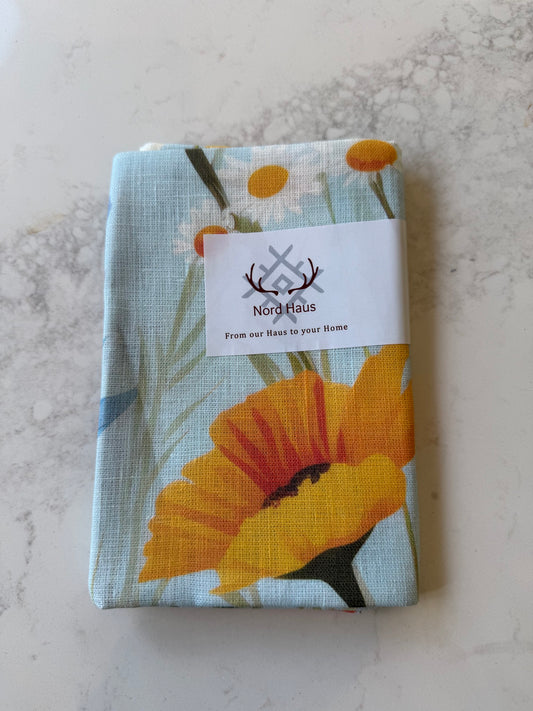 Nord Haus Fieldflower linen tea towel folded, on our kitchen bench in Bayside