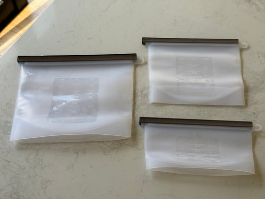 Three silicone food storage bags, 500ml, 1L and 1.5L, on our kitchen bench in Bayside